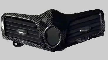 Carbon fiber air vent cover on a vehicle interior