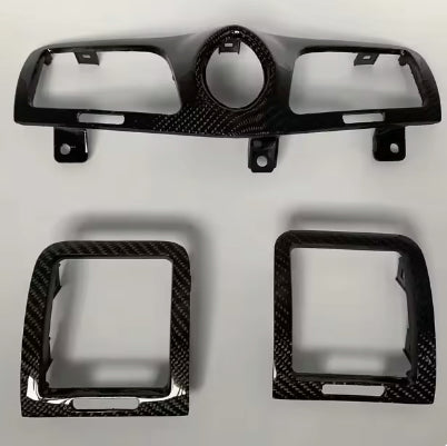 Set of carbon fiber trim caps including a clock bezel and air vent covers for a Maserati GranTurismo or GranCabrio