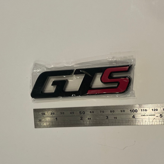 GTS logo with a ruler for scale on a white background