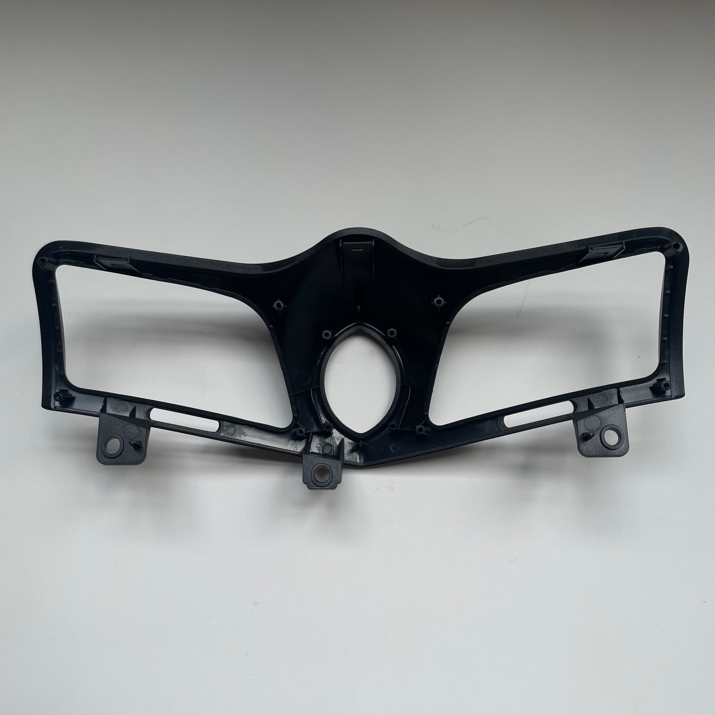 Black metal bracket on a gray background