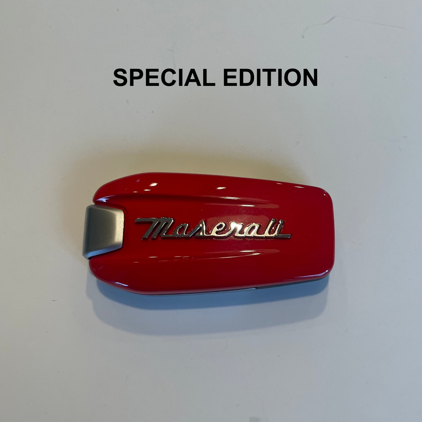 Red Maserati emblem on a white background with 'SPECIAL EDITION' text.