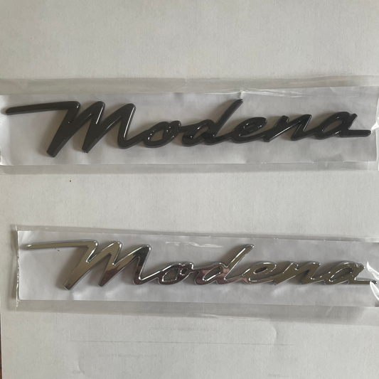 Metallic 'Modena' logo emblems on a white background