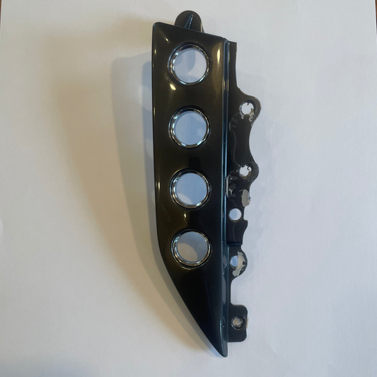 Black plastic component with circular cutouts on a white background