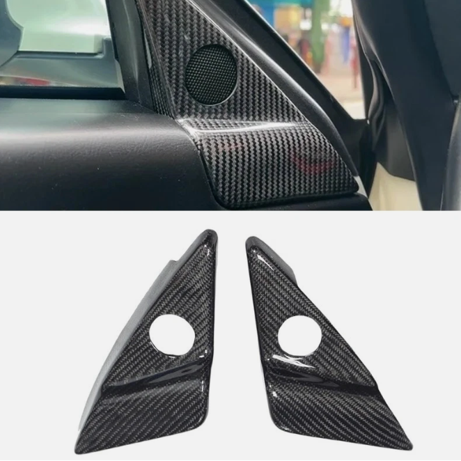 Carbon fiber car interior trim panel with a close-up of two triangular carbon fiber covers on a white background.