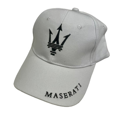Gray cap with Maserati logo on a beige background